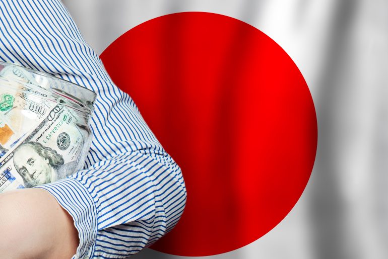 Us dollars on Japanese flag background